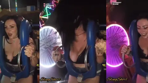 Lunaparkta oyuncakta memeleri elbiseden taşan büyük memeli karı